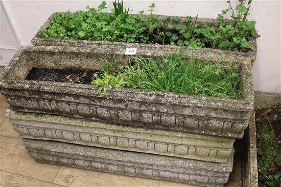A set of six concrete garden planters, L.92cm